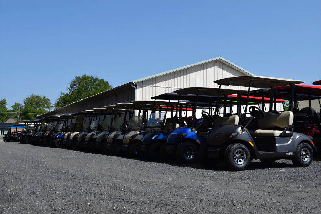 Rows of golf carts lined up outside at Mike's Golf Carts
